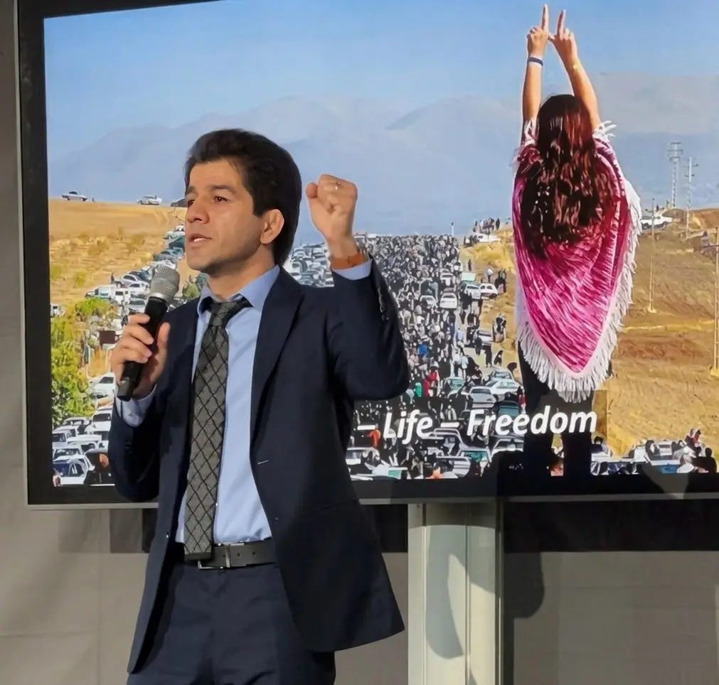 Sardar Pashaei holding a speech at Berlin Freedom Conference